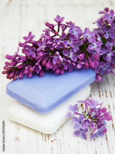 Natural soap and lilac flowers