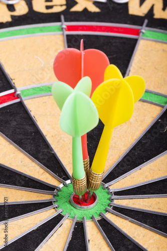 Three darts in the target center