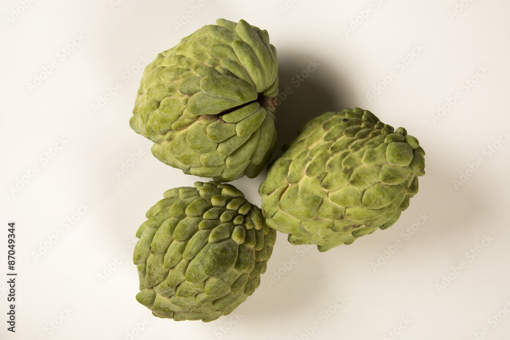 Some Sugar-Apples over a wooden table. Atemóia Some Sugar-Apples over a wooden table. Atemóia