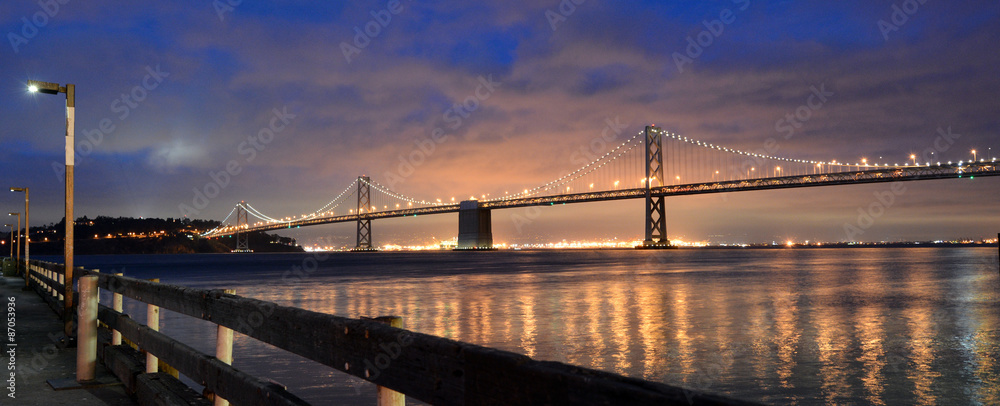 Oakland Bay Bridge lights in dusk in San Francisco, California