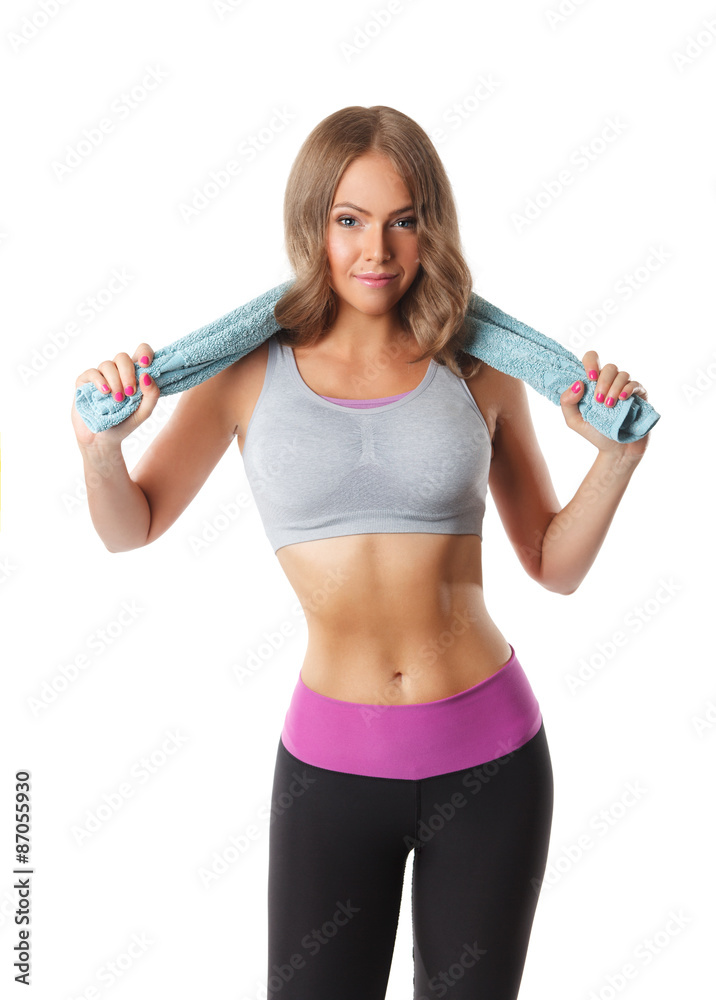 Pretty sporty woman holding a towel after workout Pretty sporty woman holding a towel after workout