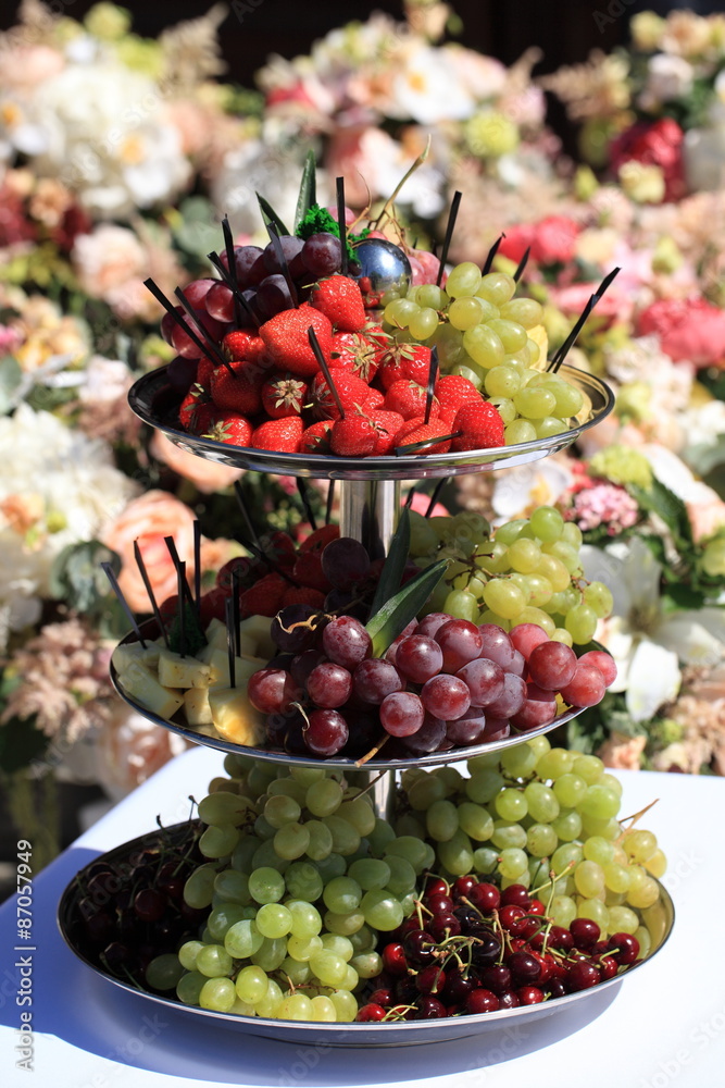 berries on festive table. strawberries, grapes, cherries on banquet