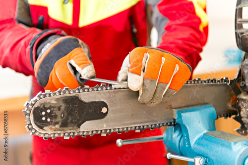 Sharpening a chainsaw
Close up on a man sharpening a chainsaw chain with file.