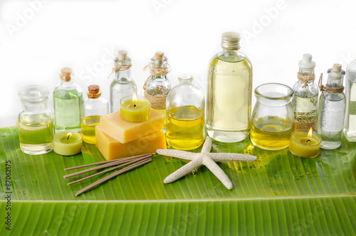 Spa set on banana leaf with massage oil and starfish