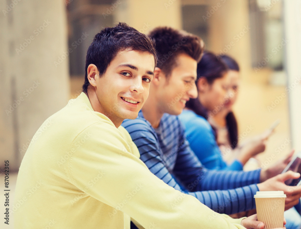 group of students with tablet pc and coffee cup group of students with tablet pc and coffee cup