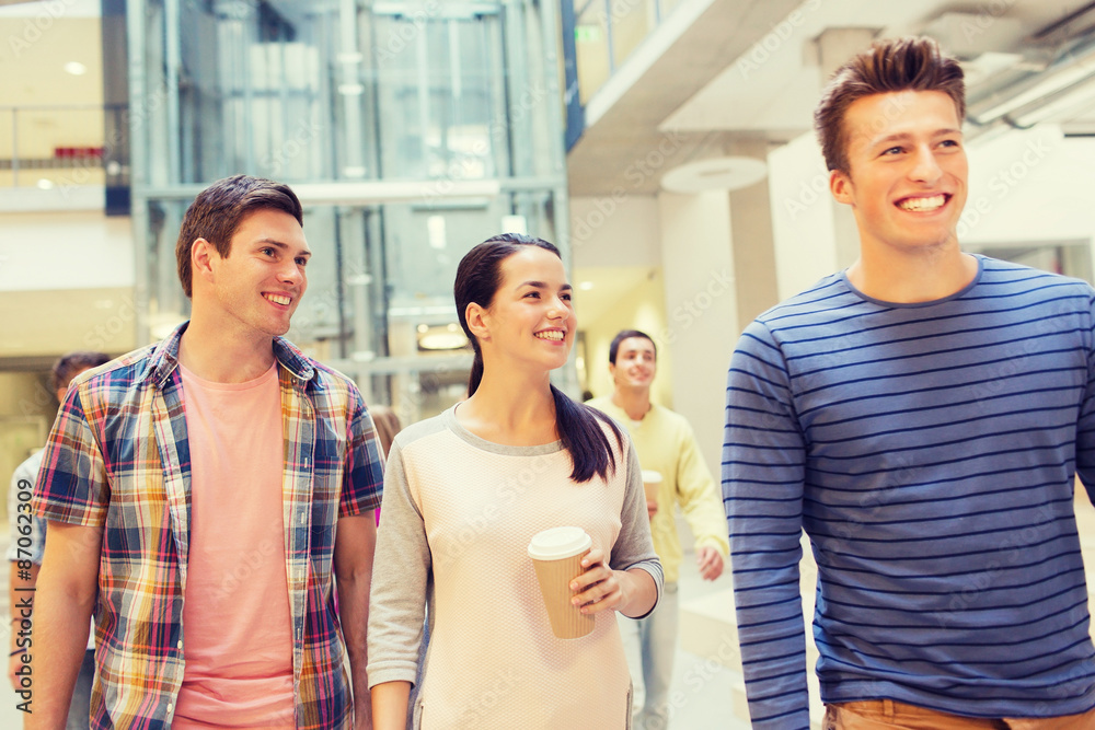 group of smiling students with paper coffee cups group of smiling students with paper coffee cups