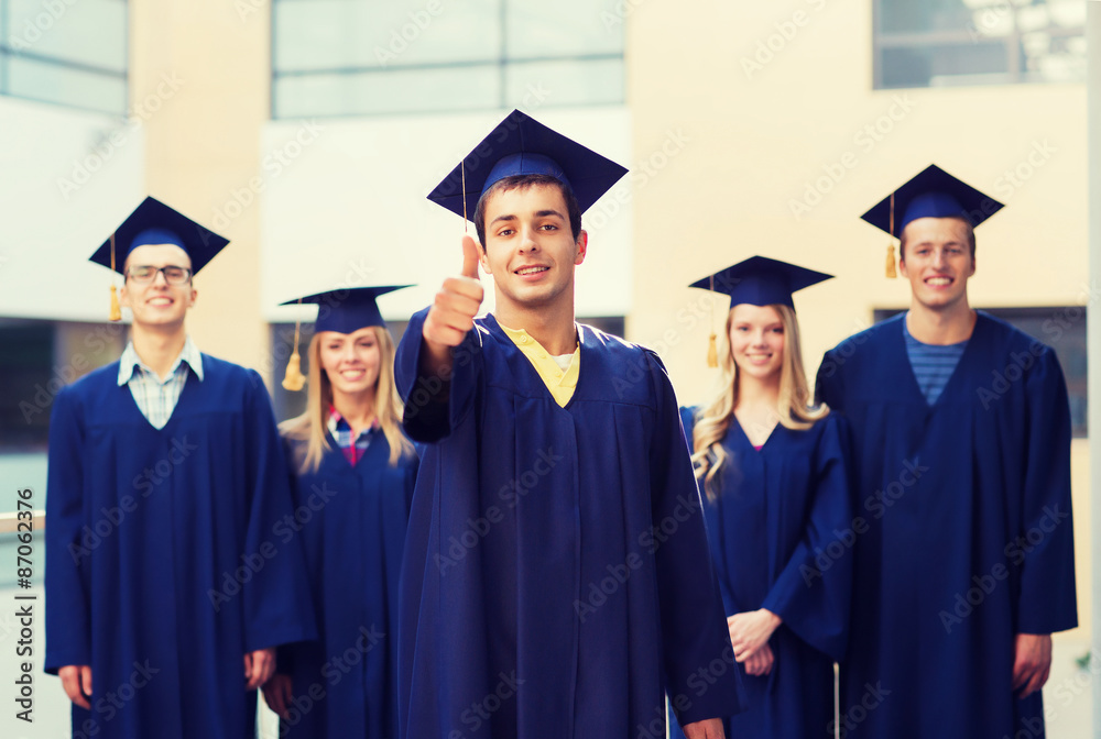 group of smiling students in mortarboards