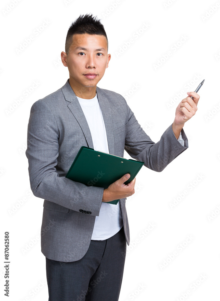 Asian businessman holding with clipboard and pen pointing up som