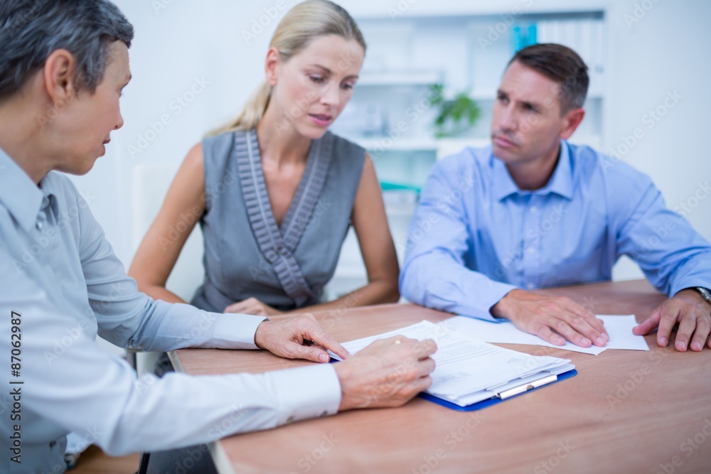 A business team brainstorming together A business team brainstorming together