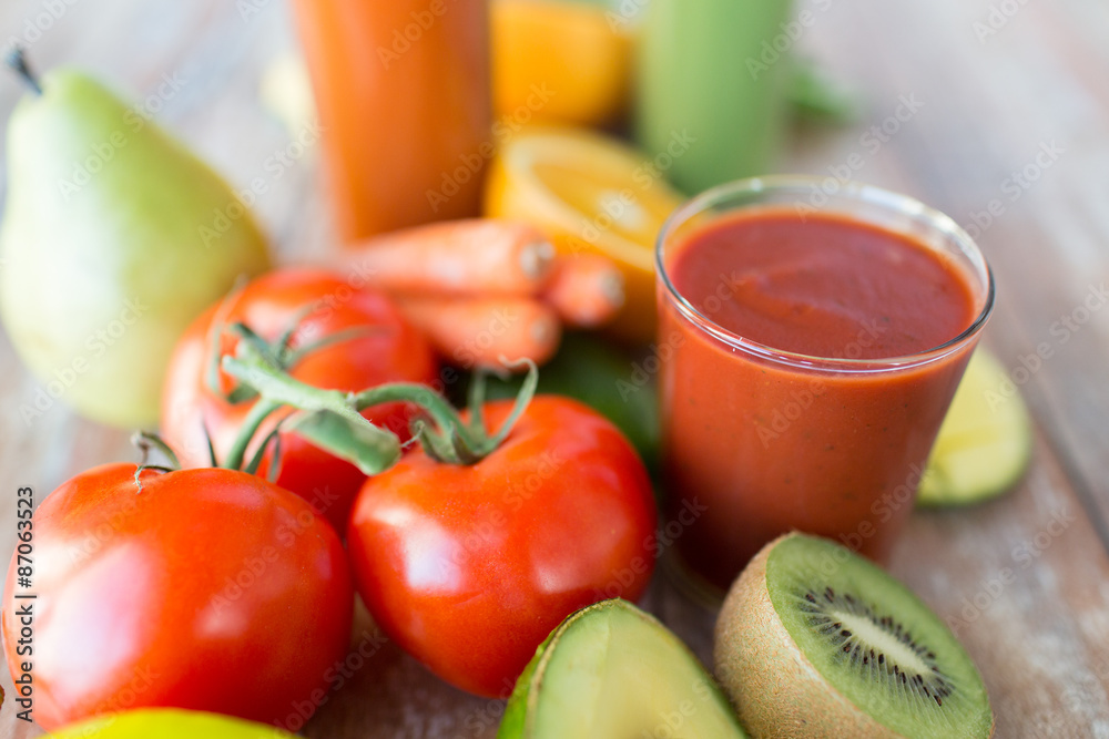 close up of fresh juice glass and fruits on table close up of fresh juice glass and fruits on table