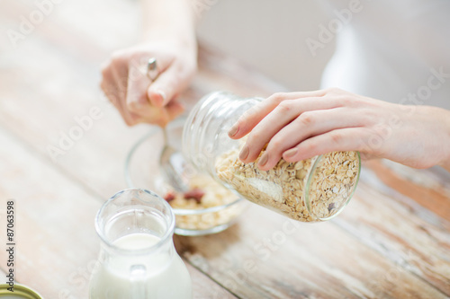 close up of woman eating muesli for breakfast