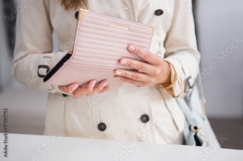 Woman opening her wallet