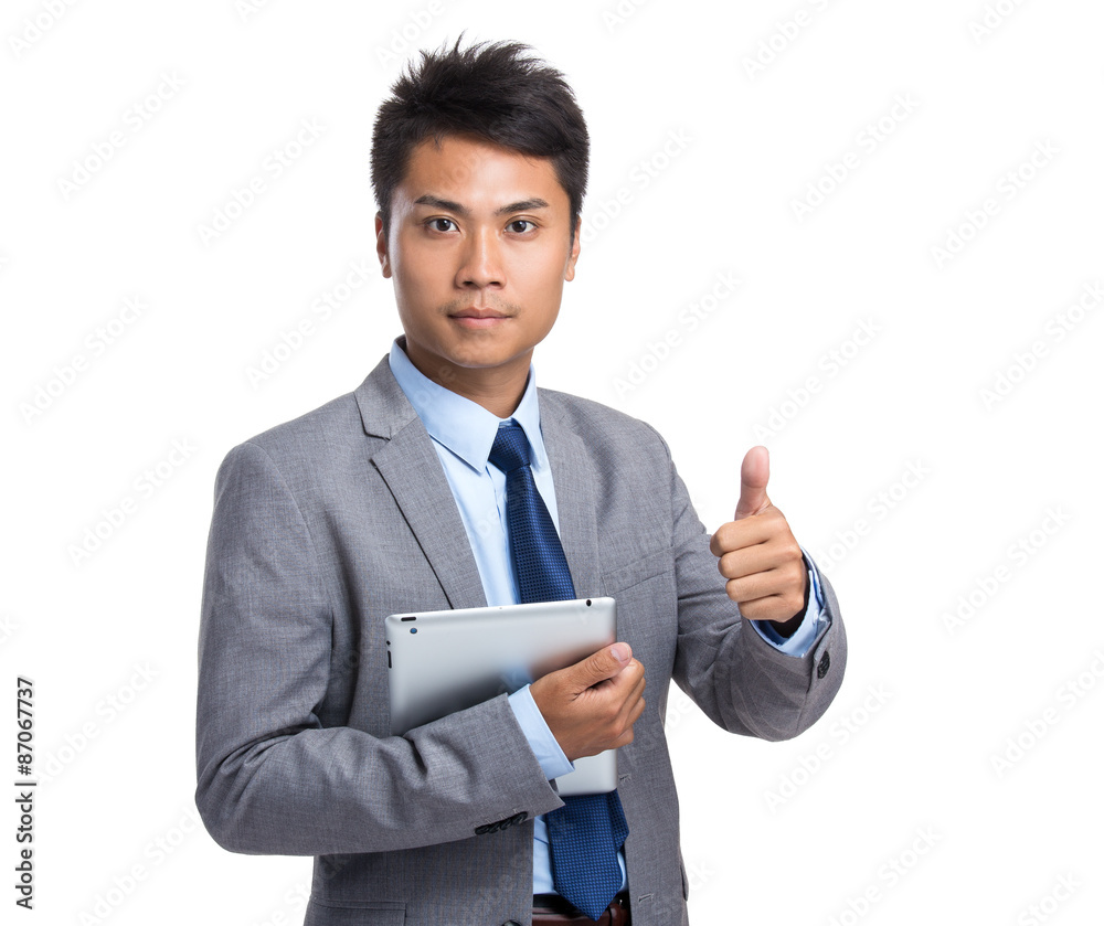 Asian young businessman hold with tablet pc and thumb up Asian young businessman hold with tablet pc and thumb up