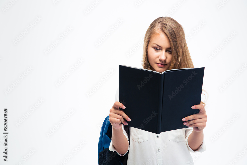 Female student with backpack reading book Female student with backpack reading book