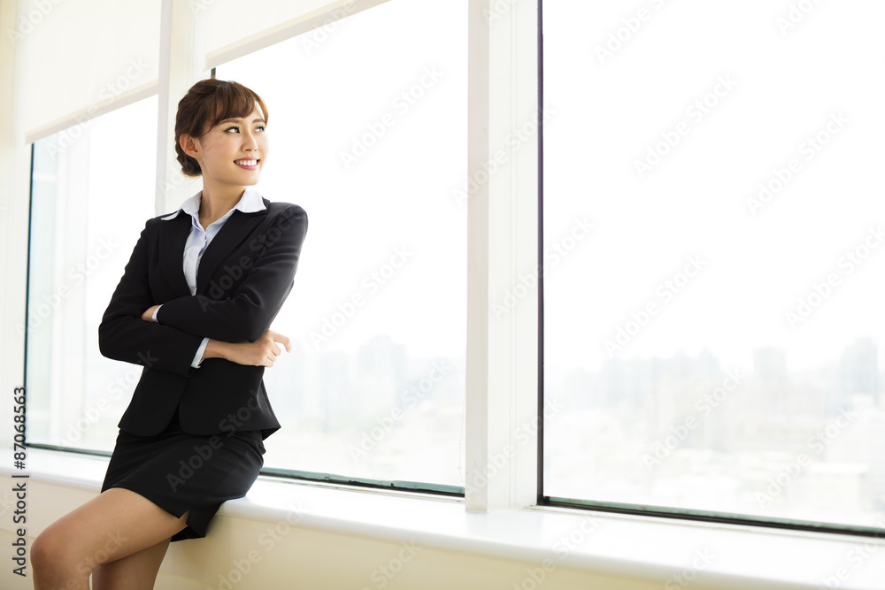 young smiling businesswoman working in the office young smiling businesswoman working in the office