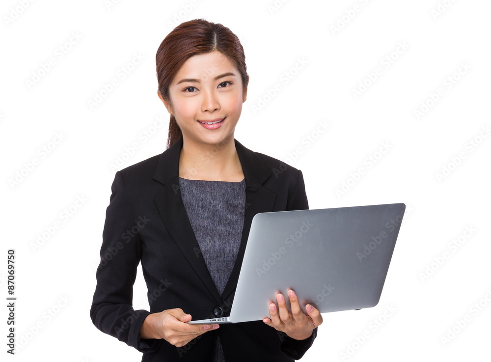 Asian Businesswoman use of the notebook computer Asian Businesswoman use of the notebook computer