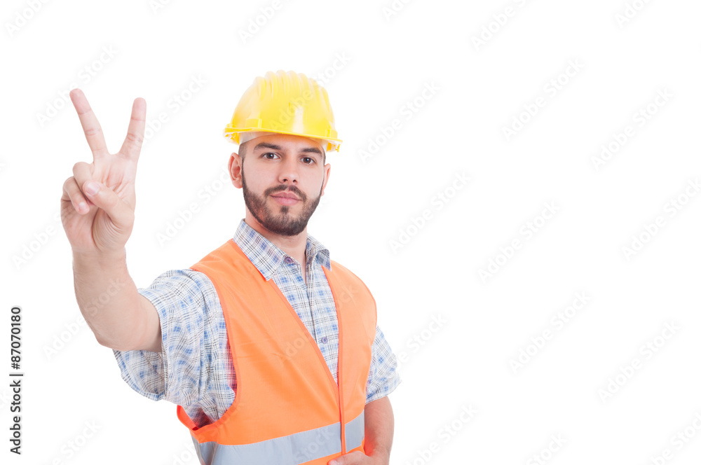 Construction worker, builder or engineer showing peace or victor Construction worker, builder or engineer showing peace or victor