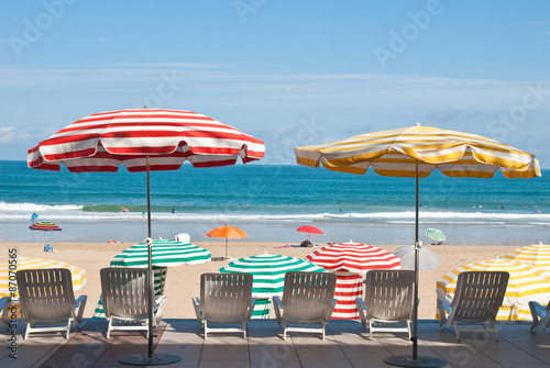 Striped umbrellas on the beach Biarritz, France 



