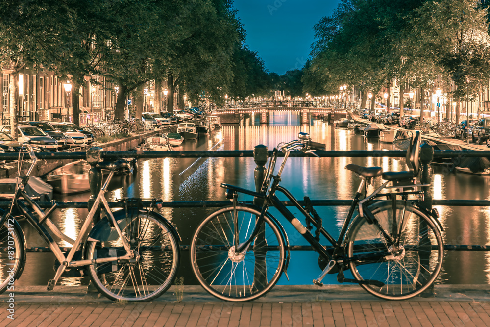 Night  illumination of Amsterdam canal and bridge