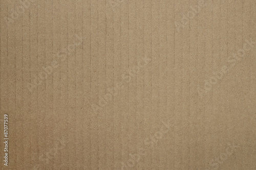 Photo of a brown cardboard background.