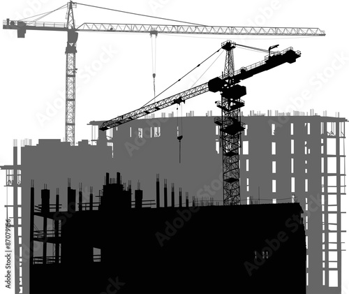 large black and grey two cranes above unfinished buildings