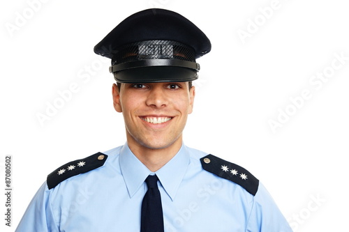 Photo Smiling young policeman on white background
