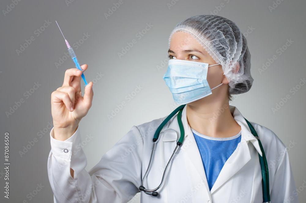 Female doctor with syringe Female doctor with syringe