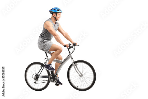 Young male biker riding a bicycle