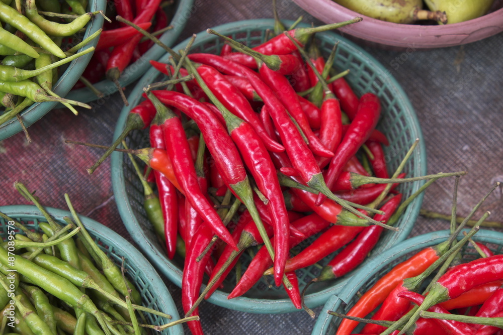Red chili pepper in the basket for sale in the wet market Red chili pepper in the basket for sale in the wet market