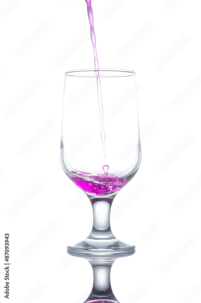 purple water flows into the glass and makes bubbles purple water flows into the glass and makes bubbles