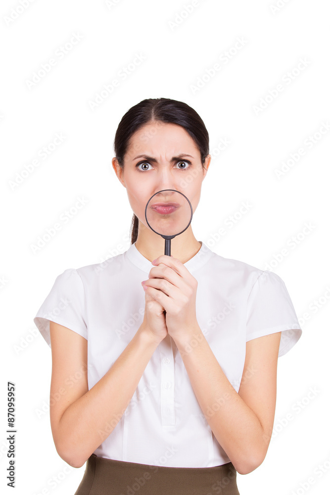 Funny portrait of girl holding magnifier near her face. Isolated Funny portrait of girl holding magnifier near her face. Isolated