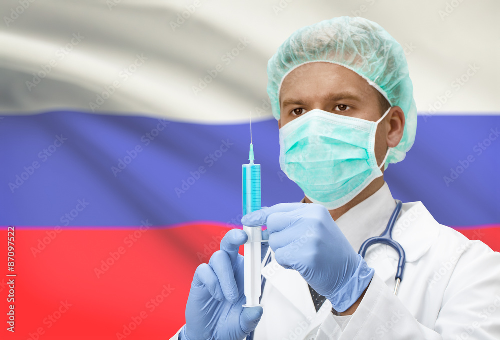 Doctor with syringe in hands and flag on background series - Russia Doctor with syringe in hands and flag on background series - Russia