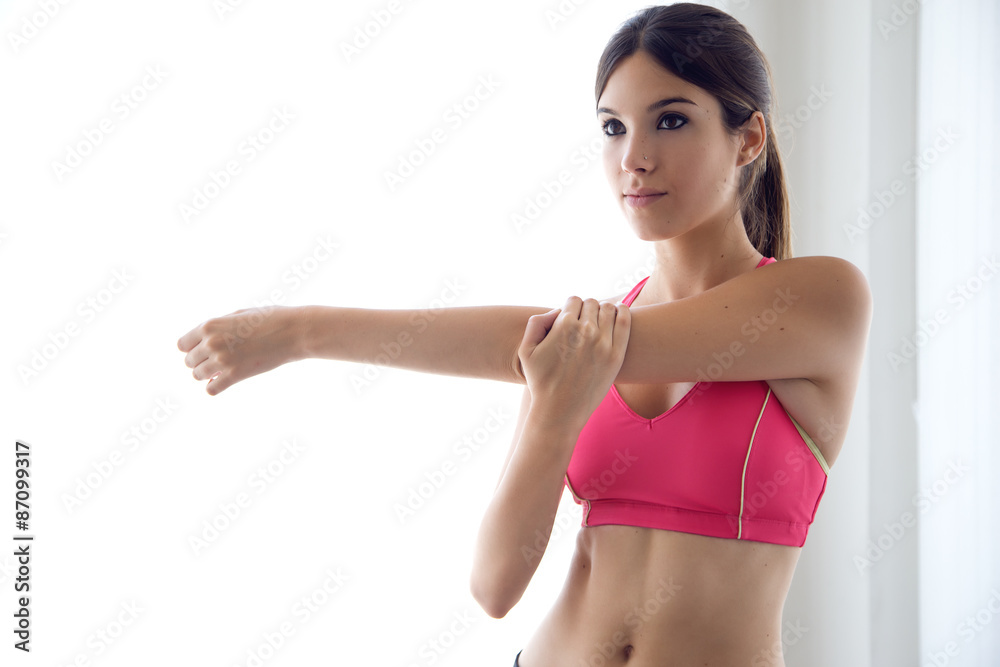 Beautiful healthy young woman doing exercise at home. Beautiful healthy young woman doing exercise at home.