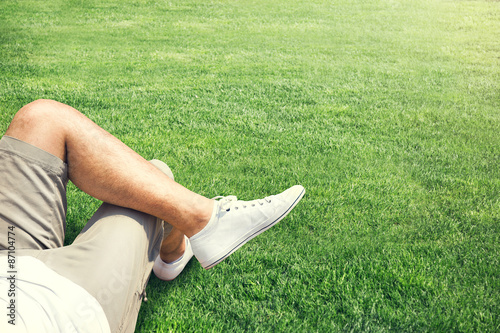 Man resting outdoor on a grass field