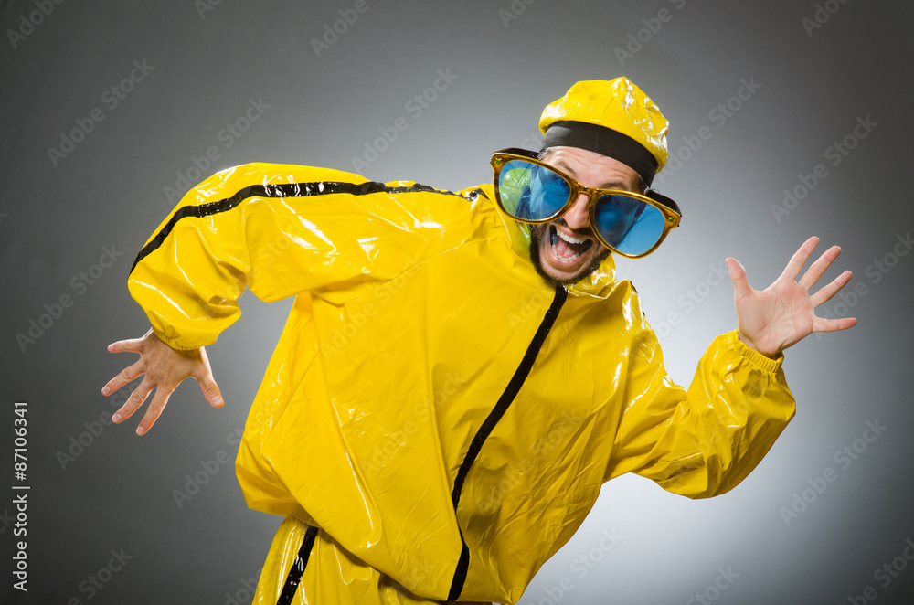 Man wearing yellow suit in funny concept Man wearing yellow suit in funny concept