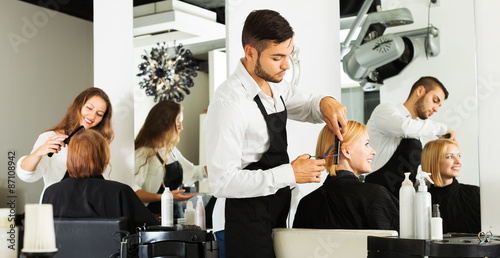 Girl cuts hair at the hair salon