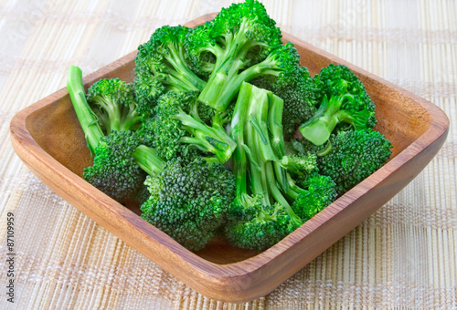 Steamed Broccoli in a Wooden Bowl – Fresh, organic steamed broccoli in a wooden bowl.