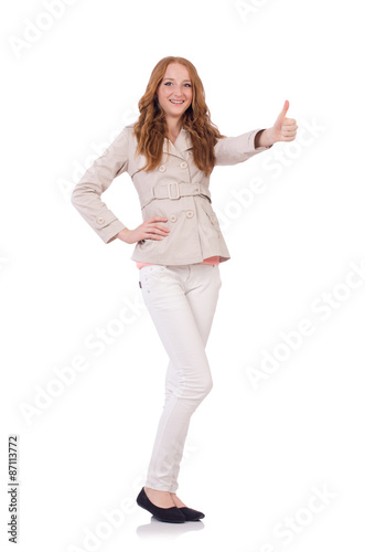 Cute smiling girl in light short coat isolated on white