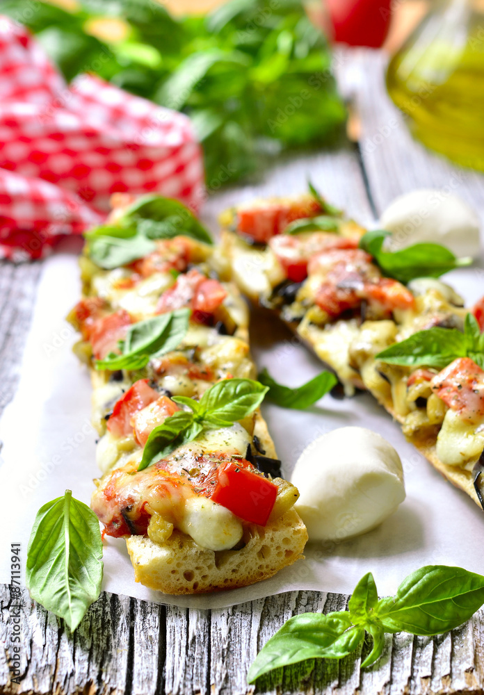 Pizza with eggplants on a french baguette. Pizza with eggplants on a french baguette.