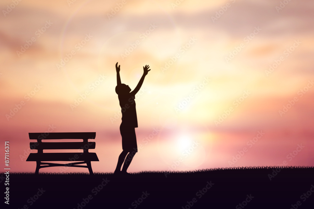 Fototapeta premium Human hand side above the background sky orange.