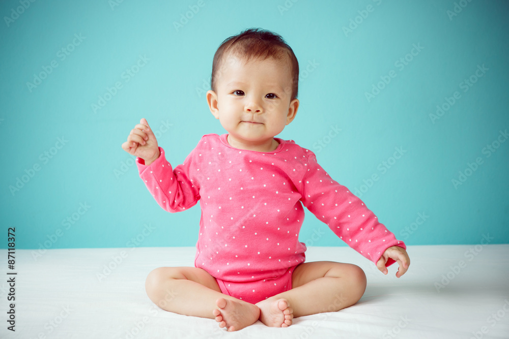 Asian baby girl wearing pink clothing Asian baby girl wearing pink clothing