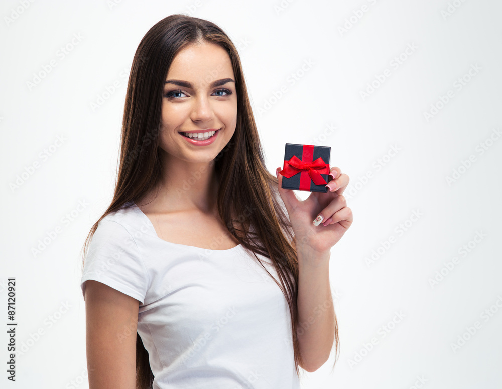 Cheerful young woman holding small gift box Cheerful young woman holding small gift box