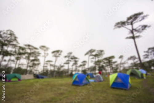 Blurred background of camping tent in the forest ,Thailand. © devilkae