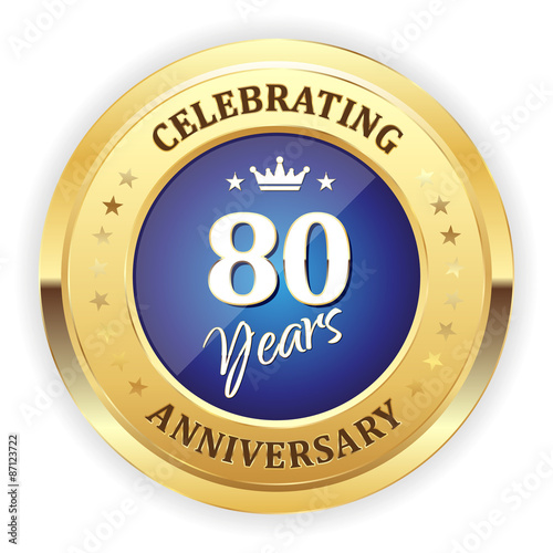 Blue celebrating 80 years badge with gold border