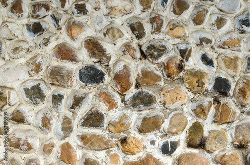 Wall round stone rock texture for backgourd. photo