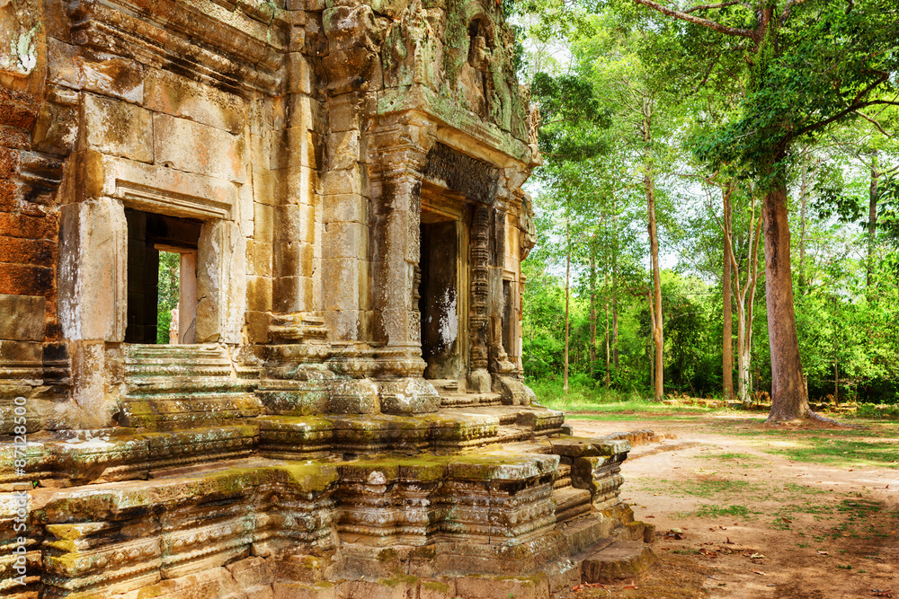 Doorway with carving of Thommanon temple in Angkor, Cambodia Doorway with carving of Thommanon temple in Angkor, Cambodia