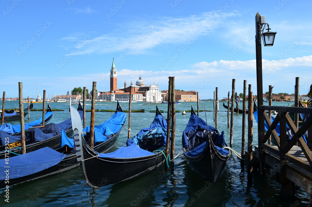 Venetian gondolas on the background of the Cathedral of San Giorgio Maggiore
