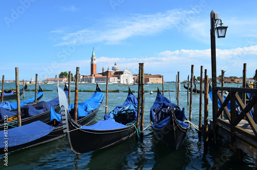 Venetian gondolas on the background of the Cathedral of San Giorgio Maggiore   © vomirak