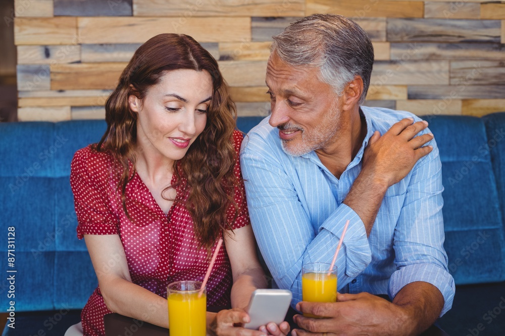 © WavebreakMediaMicro - Cute couple sitting in cafe