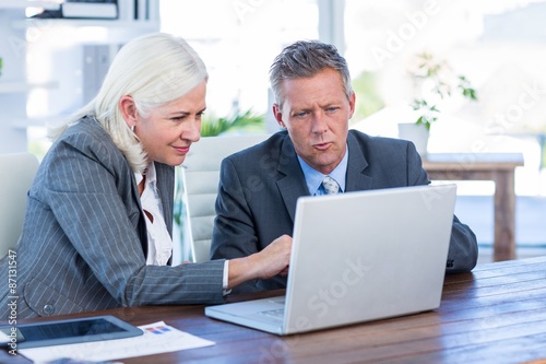 Business people working on laptop computer 